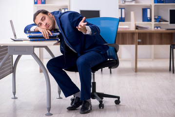 Young male businessman working in the office