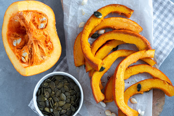 Roasted pumpkin slices with pumpkin seeds.
