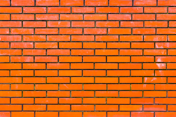 Old brick wall, old texture of red stone blocks closeup