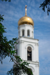 Fototapeta na wymiar Bell tower in Orthodox female monastery Iverskiy in Samara, Russia, Autumn