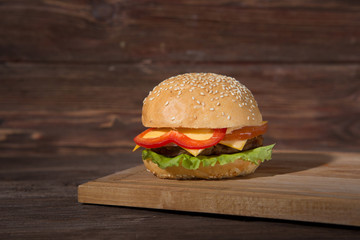 Close Up of Burger on Rustic Wooden Surface