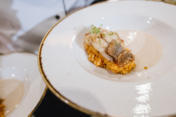 A dish with fish, bulgur and sauce
