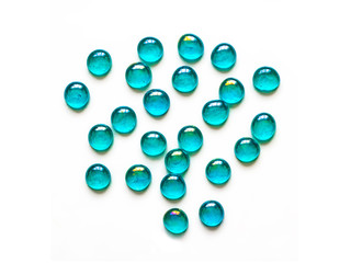 Scattering of decorative, turquoise glass stones, for home creativity