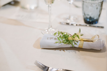 Served table at the restaurant with different decorations on the table. Preparing to celebration