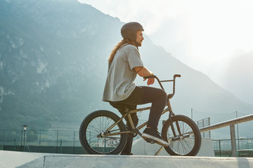 Bmx rider is making extreme stunts.