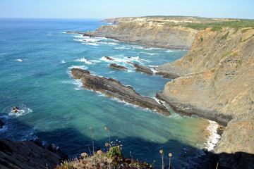 Dramatic and colorful cliffs on Alentejo West Coast at Cabo Sardao, Alentejo, Portugal