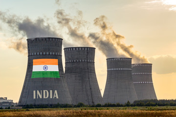 Nuclear plant chimneys displaying flag of India with according text. Energy pollution accidents in the country concept. Power production and generation from atomic energy.
