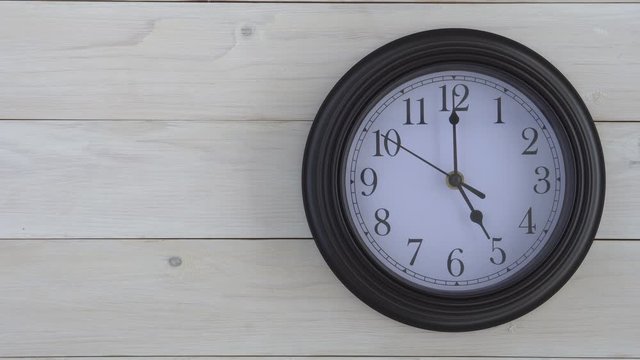 wall round clock black and white with number and clockwise on 5 o'clock straight or 5 pm am for time out or finish working and after school on vintage white wooden wall or top view table with space 4K