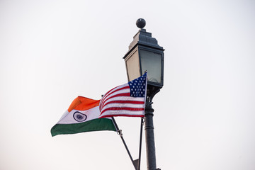 Indian and USA flags flying in New Delhi, India.
