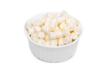 Full bowl of small white marshmallow on white background.