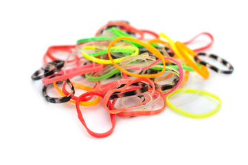 Fototapeta premium Heap of children rubber bands for hair on white.
