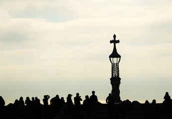 Silhouette view of a Church Spire and people around, People silhouette with a church tower