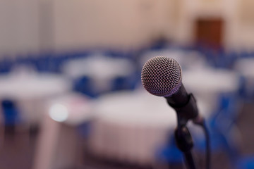 Focus on Microphone in conference room or hall, prepairing for business conference.