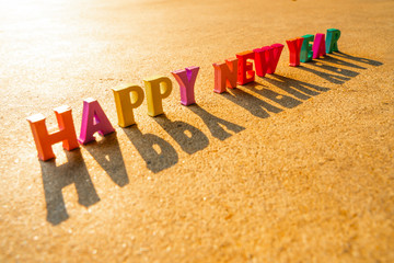 Happy New Year with many wooden letters.shallow focus effect.