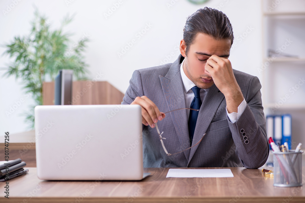 Wall mural unhappy male businessman in the office