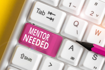 Writing note showing Mentor Needed. Business concept for wanted help for more experienced or more...