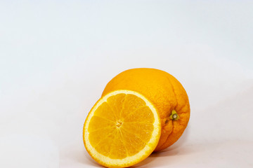 Fresh orange closeup on a white background with place for text