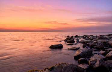 Fototapeta na wymiar black sea coast at sunset, mountains and stones