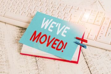 Writing note showing We Ve Moved. Business concept for To go from one residence or location to another Relocate notebook reminder clothespin with pinned sheet light wooden