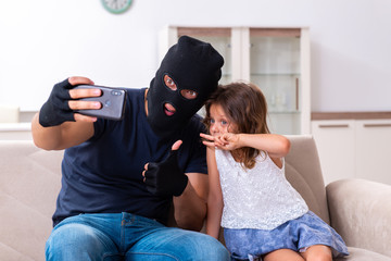 Child trafficking and abuse concept with small girl