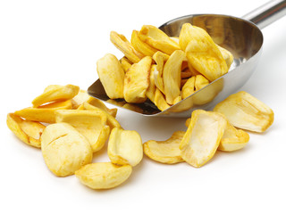 Close up of a pile of dried jackfruit chips isolated on white background