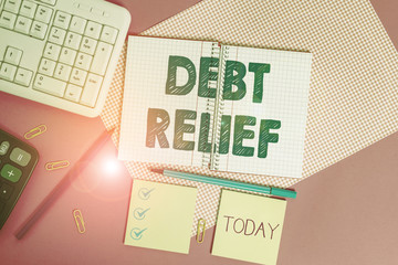 Word writing text Debt Relief. Business photo showcasing a reduction in the amount of debt that a...