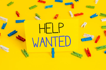 Text sign showing Help Wanted. Business photo text An ad in the paper an employer places to find a...