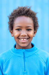 Happy african child with blue jersey