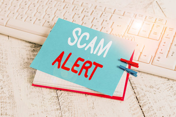 Writing note showing Scam Alert. Business concept for unsolicited email that claims the prospect of...