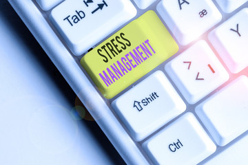 Writing note showing Stress Management. Business concept for method of limiting stress and its effects by learning ways White pc keyboard with note paper above the white background