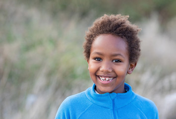 Happy african child with blue jersey