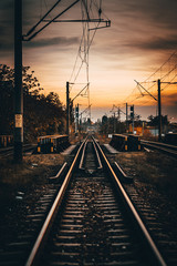 Obraz na płótnie Canvas railway train station at sunset