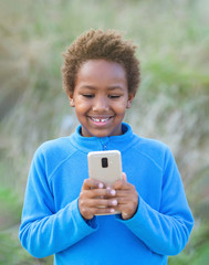 Adorable african child with a mobile phone