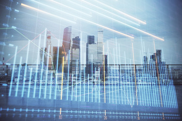 Forex graph hologram with city view from roof background. Double exposure. Stock market concept.
