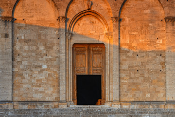 Fototapeta na wymiar Church in Tuscany is opening for evening mass. Travel destination Tuscany, Italy