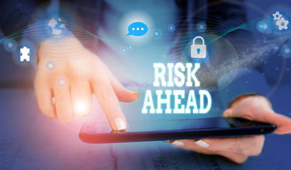 Writing note showing Risk Ahead. Business concept for A probability or threat of damage, injury, liability, loss Picture photo network scheme with modern smart device