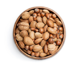 Wooden bowl with mixed nuts isolated on white