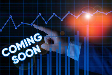 Writing note showing Coming Soon. Business concept for something is going to happen soon or after a short time