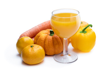 Glass of fresh made yellow juice from different ingredients