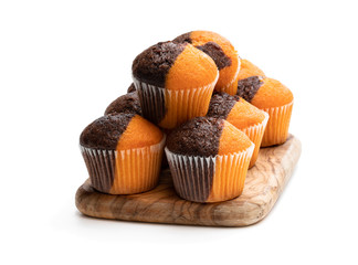 Fresh baked pumpkin and chocolate minimuffins isolated on white