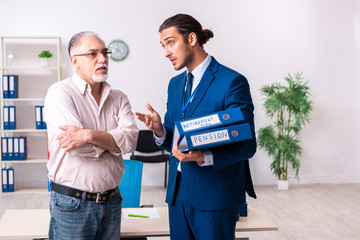 Financial advisor giving retirement advice to old man