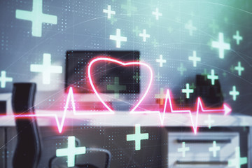 Heart hologram with desktop office background. Double exposure. Concept of medical education