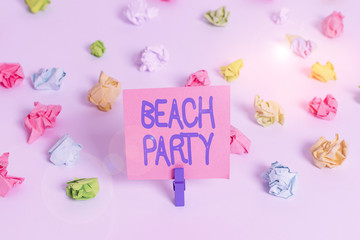 Writing note showing Beach Party. Business concept for large group of showing are organizing an event at the beach Colored crumpled paper empty reminder white floor clothespin