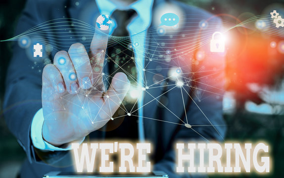 Writing note showing We Re Hiring. Business concept for process of reviewing applications and finding candidates Picture photo network scheme with modern smart device