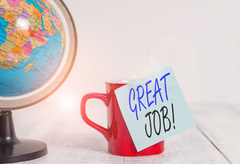 Conceptual hand writing showing Great Job. Concept meaning sed for telling someone that they have done something well Globe map coffee cup sticky note lying vintage wooden table
