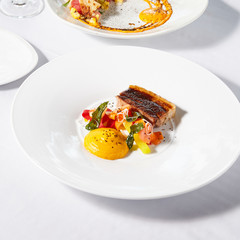 Beautiful and tasty food on a plate, exquisite dish, creative restaurant meal concept.