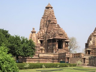 Beautiful image of Kandariya Mahadeva temple, Khajuraho, Madhyapradesh, India with blue sky and...