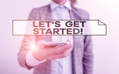 Handwriting text Let S Is Get Started. Conceptual photo to begin doing or working on something you had started Business concept with mobile phone and business woman