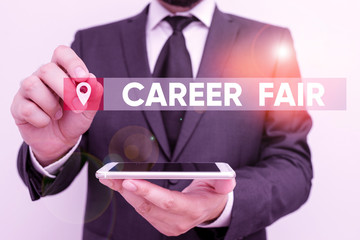 Conceptual hand writing showing Career Fair. Concept meaning an event at which job seekers can meet possible employers Male human wear formal work suit hold smartphone using hand