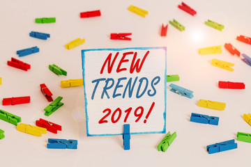 Handwriting text New Trends 2019. Conceptual photo general direction in which something is developing Colored clothespin papers empty reminder white floor background office
